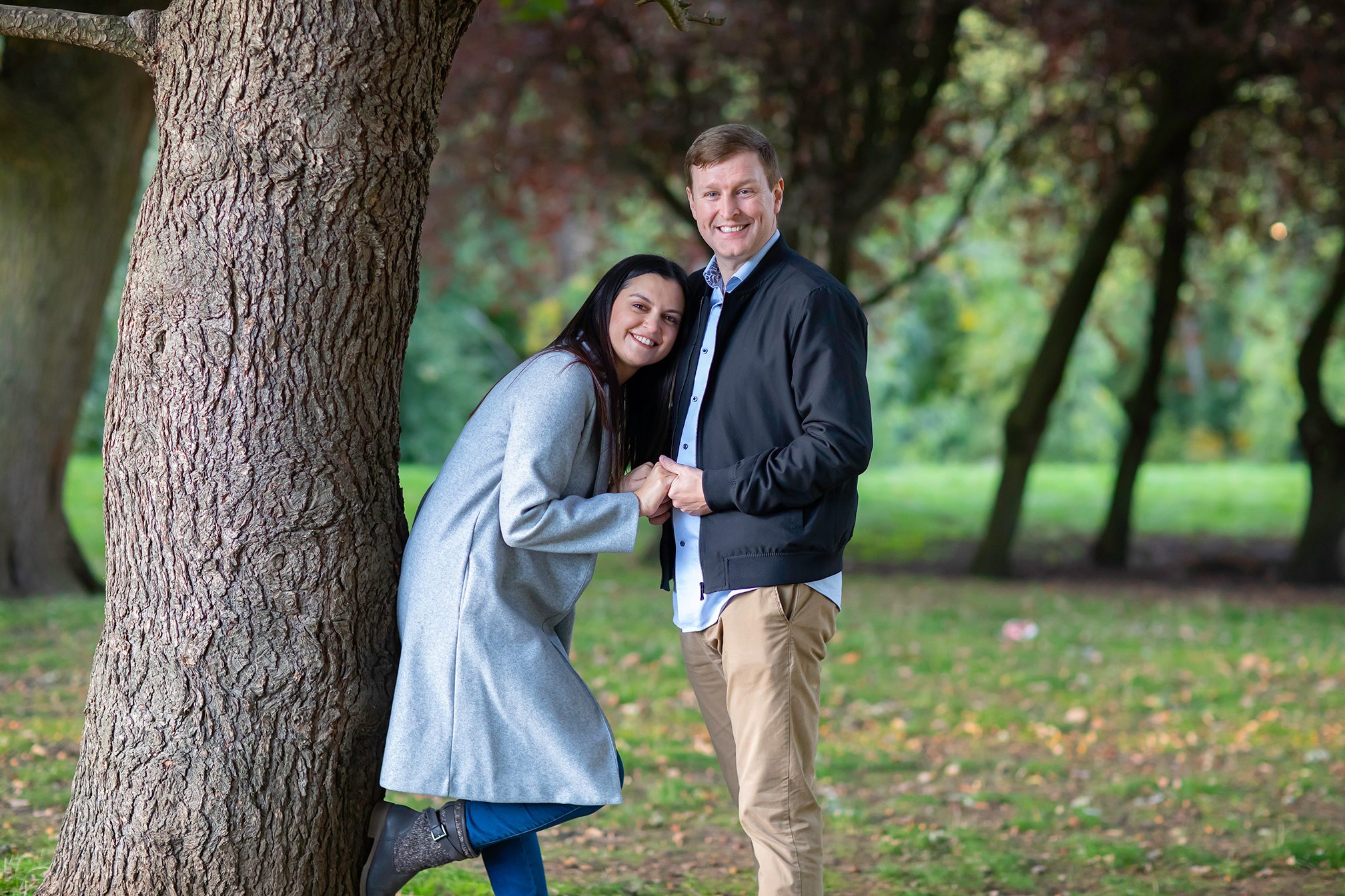 Couple by tree Alexandra Palace engagement photo shoot
