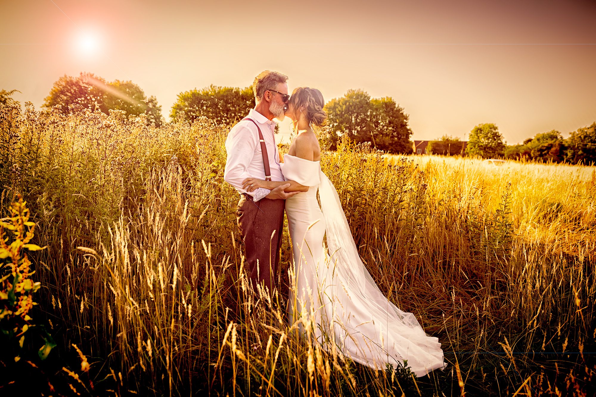 Barnet-wedding-photographer-bride-and-groom-in-field-Beaumont-Hall-St-Albans