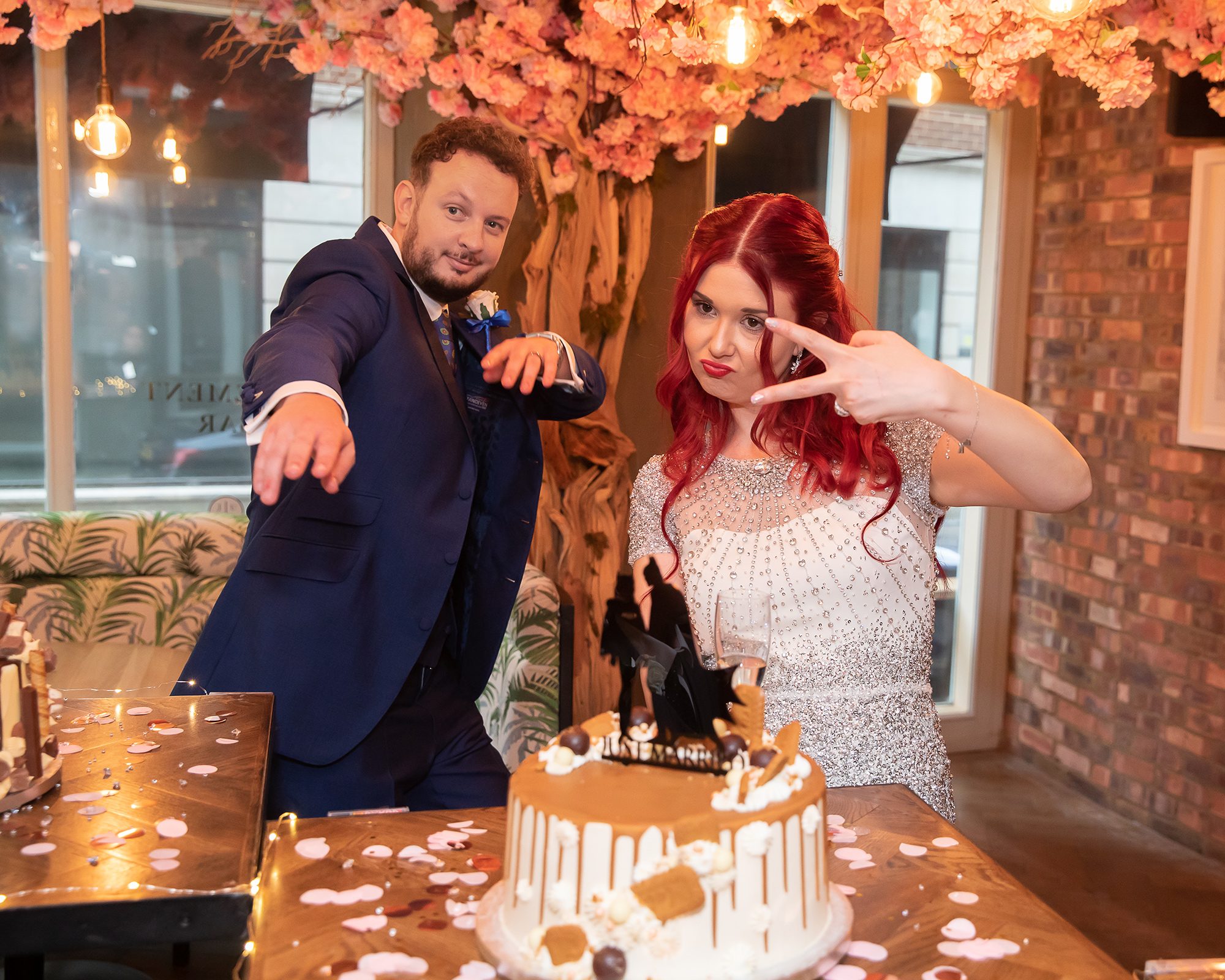 Cake cutting with bride and groom Juno Rooms London