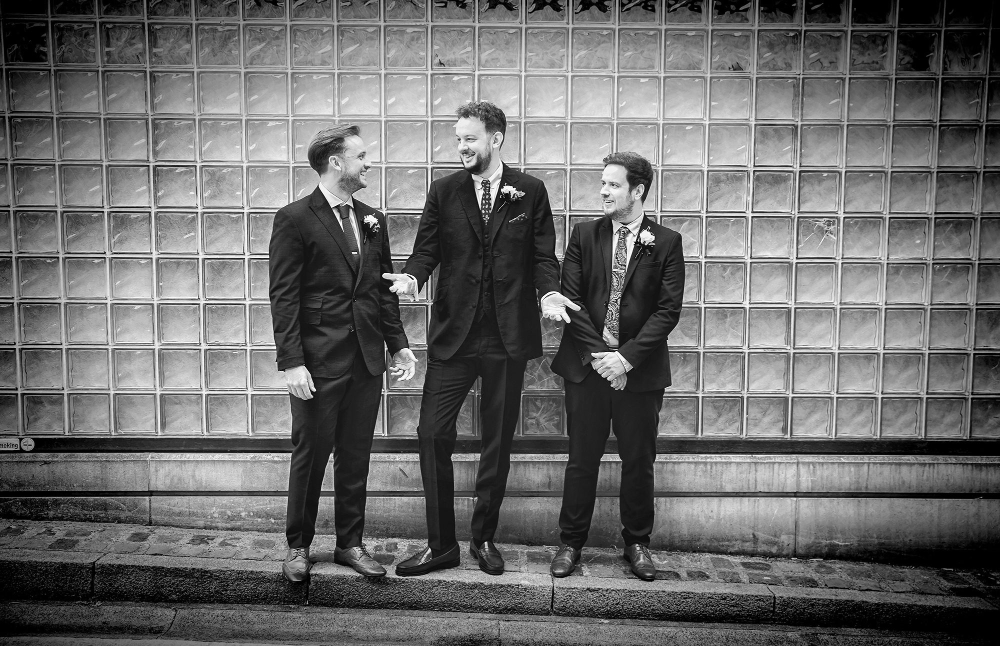 Groomsmen laughing together Islington wedding day