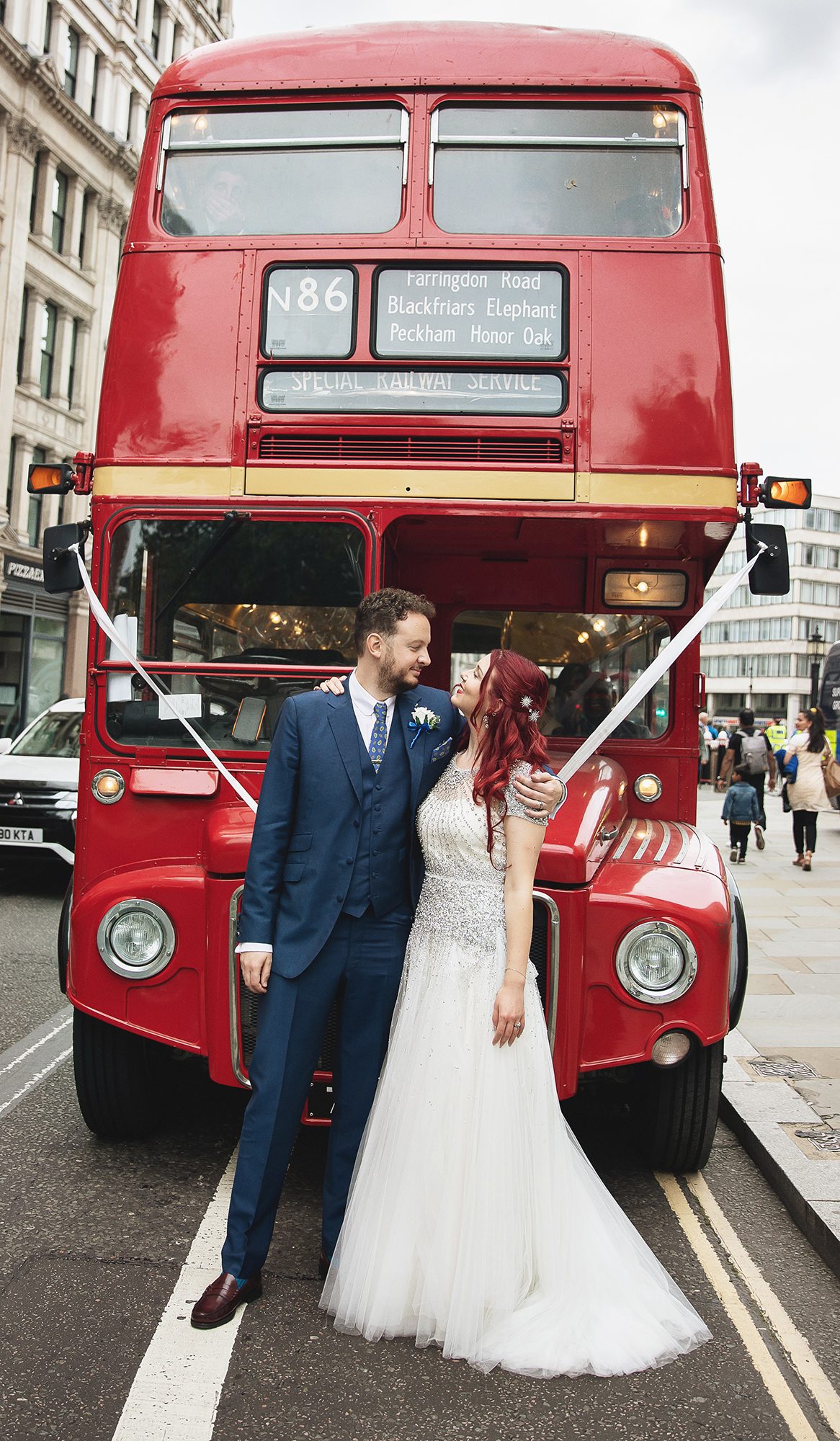 Islington wedding couple by London routemaster bus
