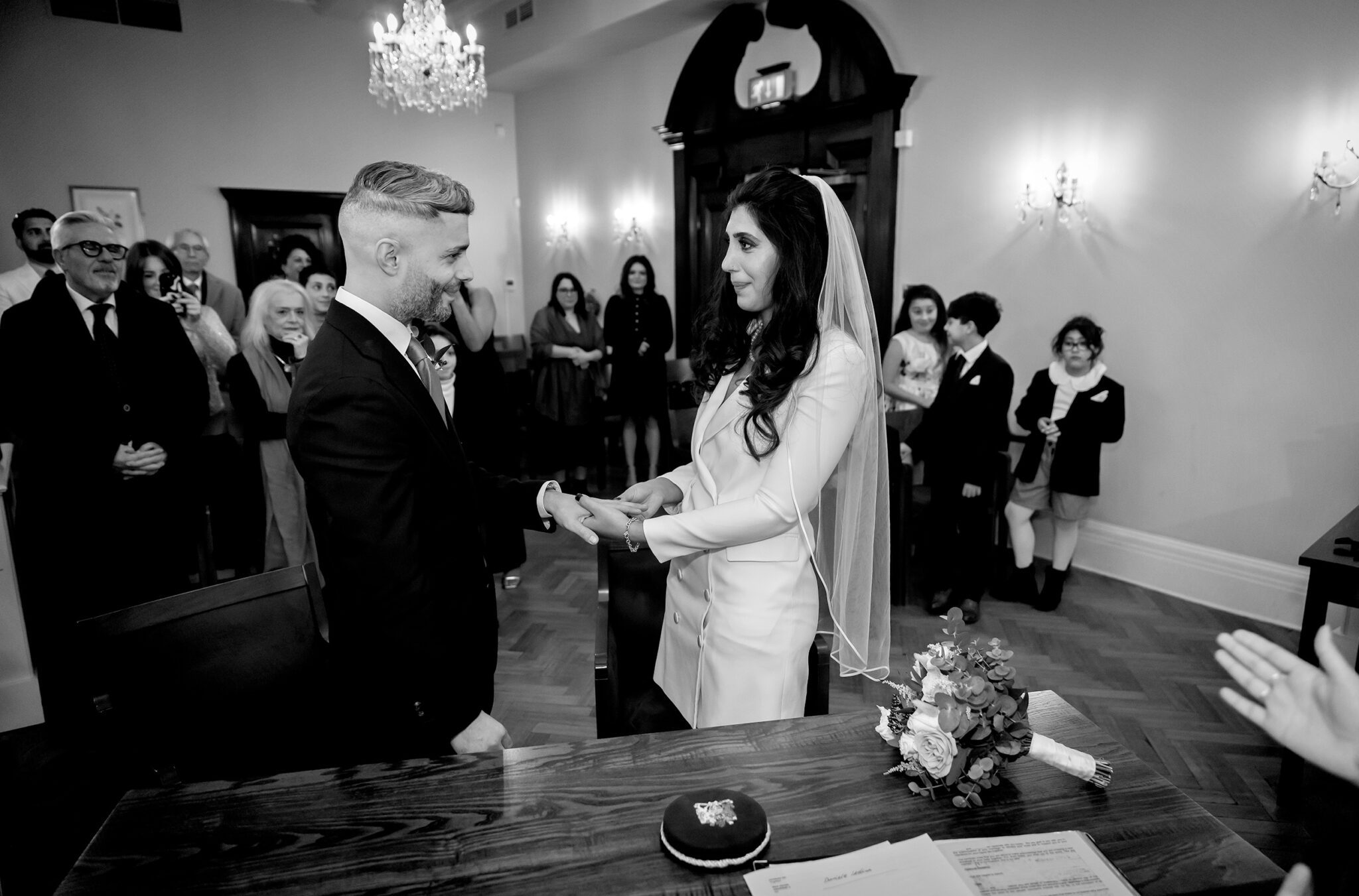 Exchange of rings at Chelsea Old Town Hall wedding ceremony two