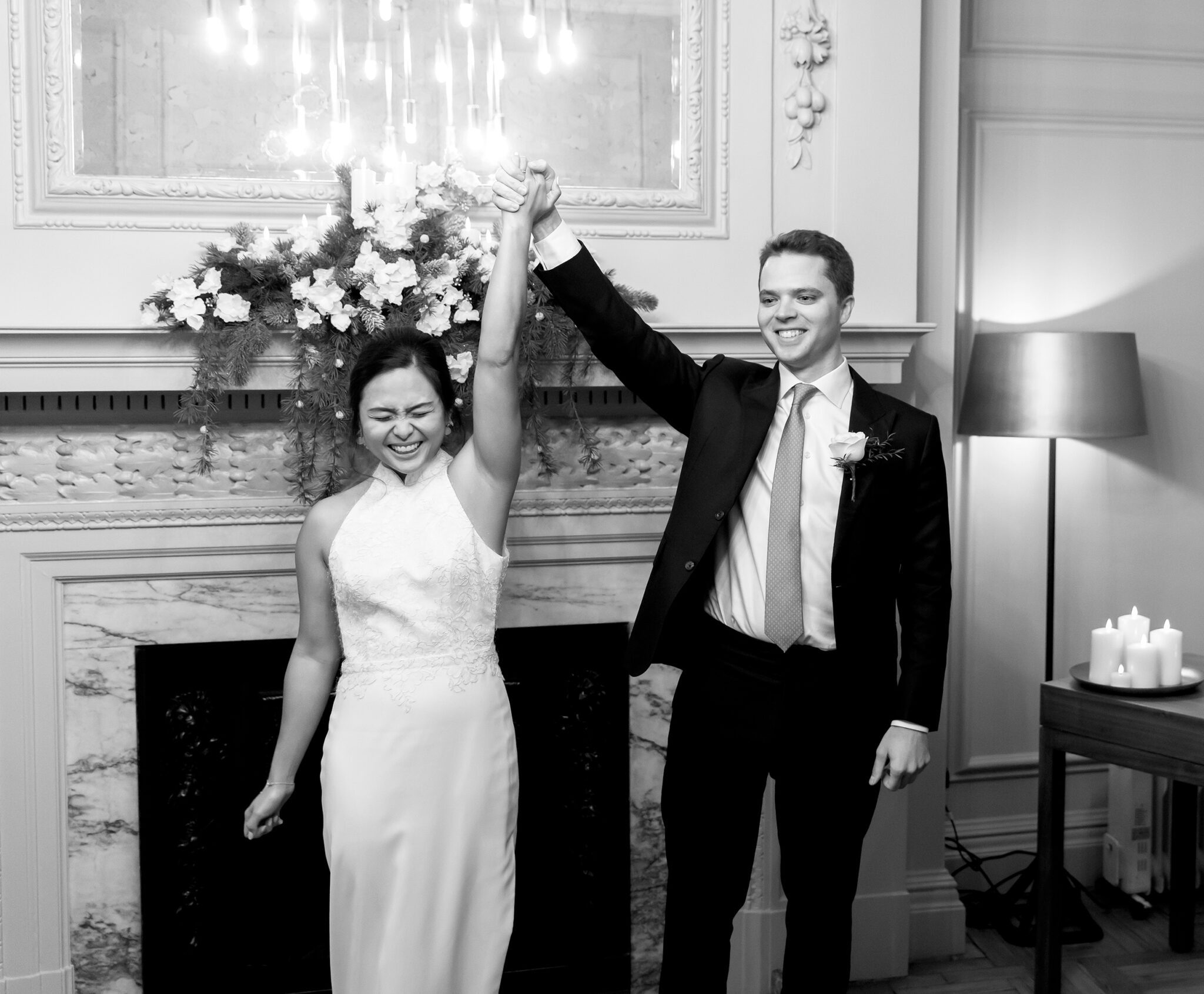 Bride and groom celebrate in wedding ceremony Old Marylebone Town Hall