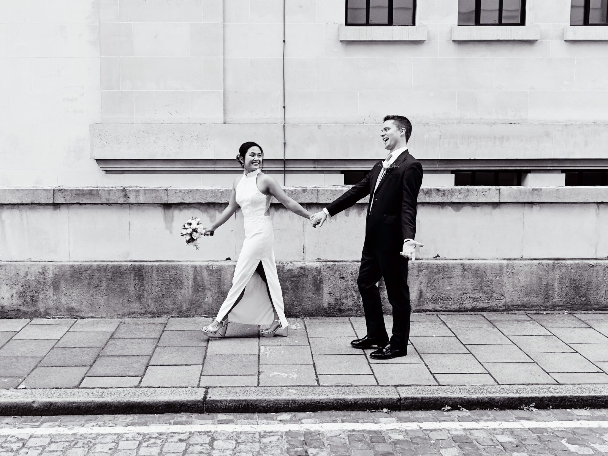 Bride and groom walk to their Old Marylebone Town Hall wedding