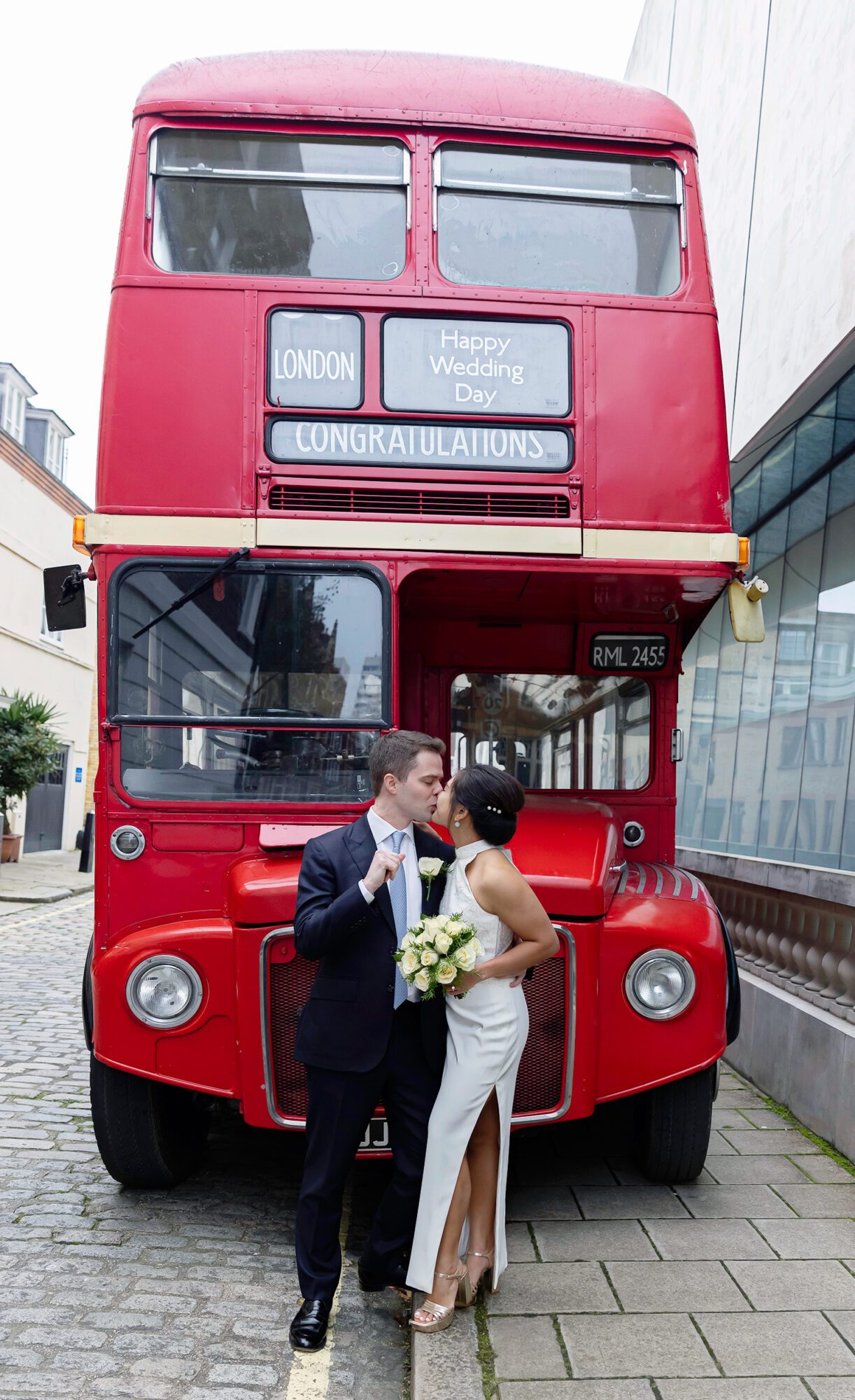 Wedding bus and bride and groom Old Marylebone Town Hall